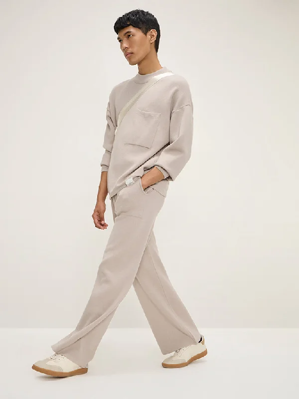 Men's pastel - colored cotton shorts for a spring - friendly outfitStudiofit Beige Knitted Relaxed-Fit Mid-Rise Track Pants Men's pastel - colored cotton shorts for a spring - friendly outfitStudiofit Beige Knitted Relaxed-Fit Mid-Rise Track Pants