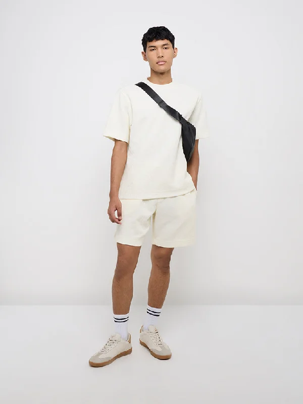 Men's side - stripe track shorts for a sporty running lookStudiofit Off-White Knitted Relaxed-Fit Mid-Rise Shorts Men's side - stripe track shorts for a sporty running lookStudiofit Off-White Knitted Relaxed-Fit Mid-Rise Shorts