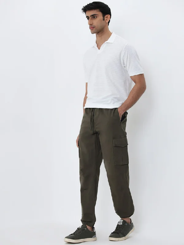 Men's elastic waistband lounge shorts for lazy weekends at homeWES Casuals Olive Relaxed-Fit Mid-Rise Cotton Blend Joggers Men's elastic waistband lounge shorts for lazy weekends at homeWES Casuals Olive Relaxed-Fit Mid-Rise Cotton Blend Joggers